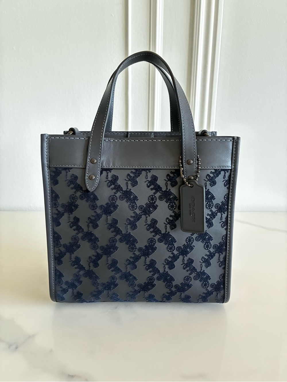 Coach Field Tote in midnight navy featuring a textured horse and carriage